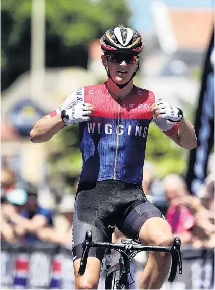  ?? PHOTO: JOHN COWPLAND ?? Clear winner . . . James Fouche celebrates winning overall honours in the national men’s road cycling race in Napier yesterday.