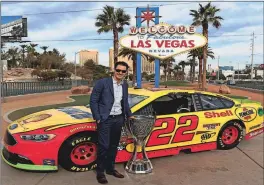  ?? LAWDERMILK] [NASCAR GETTY IMAGES/BRIAN ?? New NASCAR champion Joey Logano did the customary photo op at the Vegas strip gateway during NASCAR Champion’s Week.