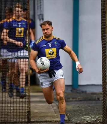  ??  ?? Wicklow’s Dean Healy leads his team out for the Allianz National Football League Division 4 clash with Antrim in Aughrim on Saturday afternoon.