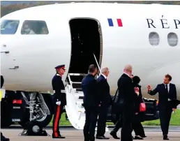  ?? ?? Plane talk: German chancellor Angela Merkel, left, and France’s Emmanuel Macron arrived on official government aircraft