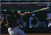  ?? ASHLEY LANDIS — THE ASSOCIATED PRESS FILE ?? The San Francisco Giants’ Buster Posey breaks a bat while hitting for a double during the first inning of a spring training game against the Chicago Cubs on March 10 in Scottsdale, Ariz.