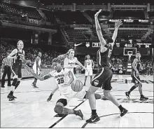  ?? CHARLES REX ARBOGAST] [AP PHOTO/ ?? DePaul forward Mart’e Grays falls to the court after losing control of the ball as Connecticu­t forward Gabby Williams defends during Friday’s game in Chicago. NO. 15 MARYLAND 80, GEORGE WASHINGTON 54: