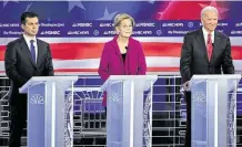  ?? Saul Loeb / AFP via Getty Images ?? With Pete Buttigieg, left, on the rise, the Democratic presidenti­al candidates again clashed over “Medicare for All” during Wednesday’s debate in Atlanta.