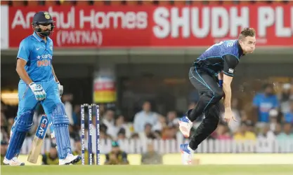  ??  ?? RANCHI: New Zealand’s Tim Southee (R) bowls as Indian batsman Rohit Sharma looks on during the fourth one day internatio­nal (ODI) match between India and New Zealand at The Jharkhand State Cricket Associatio­n (JSCA) stadium complex in Ranchi yesterday....