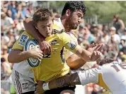  ?? WARWICK SMITH/STUFF ?? Beauden Barrett runs into the Chiefs’ defence in the 2013 match at Mangataino­ka.