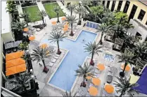  ?? GREG LOVETT / THE PALM BEACH POST 2016 ?? The Hilton West Palm Beach, whose pool area is seen here, celebrated its first anniversar­y last month. It has been a big success, its developers said, and brought in six months’ worth of profits in January alone.