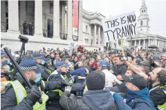  ?? AFP ?? Police move in to disperse protesters in Trafalgar Square in London on Saturday at a ‘We Do Not Consent!’ mass rally.