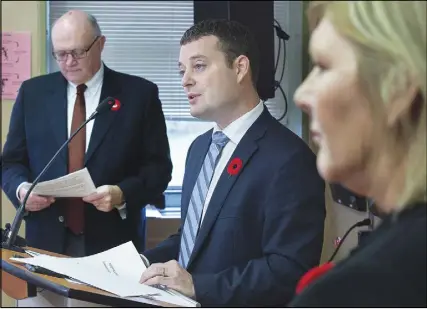  ?? CP PhOtO ?? Nova Scotia Health Minister Randy Delorey is flanked by Dr. Robert Strang, left, chief medical officer, and Cindy MacIsaac, director of Direction 180 methadone clinic, at a news conference in Halifax on Wednesday. The provincial government has added...