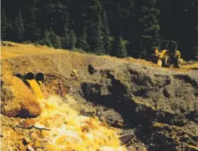  ??  ?? Toxic wastewater from the inactive Gold King Mine pours out of pipes Aug. 7 along the Animas River near Silverton. Brent Lewis, Denver Post file