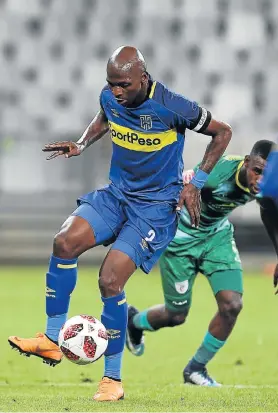  ?? Picture: CARL FOURIE/GALLO IMAGES ?? HANGING ONTO IT: Thami Mkhize, of Cape Town City, controls possession during the Absa Premiershi­p soccer match against Baroka at Cape Town Stadium on Saturday