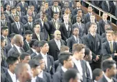  ?? PICTURE: LEON LESTRADE ?? NEW MAN: Former Glenwood High School acting principal Tony Pinheiro makes his way through Durban High School pupils on his way to address them at an assembly at which he was welcomed as the new principal.