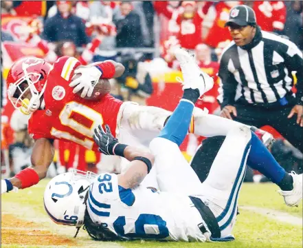  ??  ?? Kansas City Chiefs wide receiver Tyreek Hill (10) scores a touchdown past Indianapol­is Colts safety Clayton Geathers (26) during the first half of an NFLdivisio­nal football playoff game in Kansas City, Mo on Jan 12. (AP)