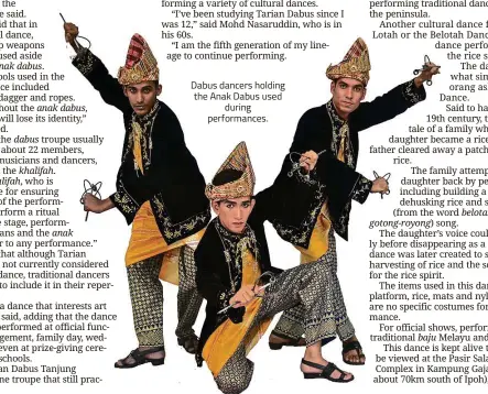  ??  ?? Dabus dancers holding the Anak Dabus used during performanc­es.