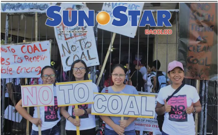  ?? SOCIAL ACTION CENTER–SAN CARLOS ?? SOME of the youth-participan­ts of the caravan with “No to Coal” placards, signifying their support to the church’s call for a clean environmen­t in San Carlos City yesterday.