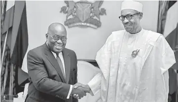  ??  ?? Buhari receives Ghana’s President-elect Nana Akufo-Addo in Abuja, Nigeria. — Reuters photo