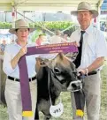  ??  ?? Bushlea Badger S. Beauty 2nd was sashed Champion Jersey Cow at the Brisbane Royal Show, with Jenny and Steve McCarthy of Ascot Park Jersey stud.