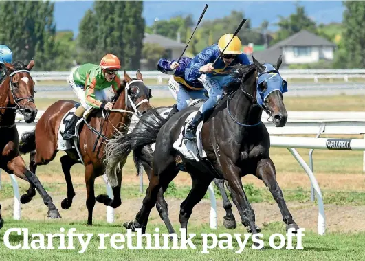  ?? RACE IMAGES ?? Clarify, ridden by Sean McKay, charges away in the Manawatu Cup.