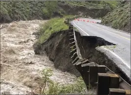  ?? PHOTOS BY NATIONAL PARK SERVICE VIA AP ?? In this photo provided by the National Park Service, is high water in the Gardiner River along the North Entrance to Yellowston­e National Park in Montana, that washed out part of a road on Monday.