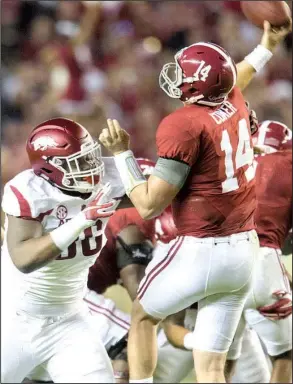  ?? NWA Democrat-Gazette/ARMON WATTS ?? Arkansas defensive lineman Armon Watts (left), pressuring then-Alabama quarterbac­k Jake Coker during his freshman season in 2015, hasn’t made much of an impact during his career, but the 6-5, 315-pound junior is expected to be a key contributo­r in the...