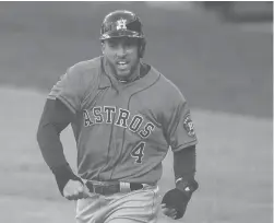  ?? GREGORY BULL/AP ?? The Astros’ George Springer reacts after scoring on a single by Jose Altuve against the Rays during the fifth inning in Game 6 of the ALCS on Oct. 16 in San Diego.