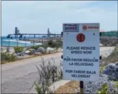  ?? STEPHAN KOGELMAN — THE ASSOCIATED PRESS ?? A warning sign stands near the PDVSA/ BOPEC Brasil Terminal on the island of Bonaire, where Venezuela refines and stores its heavy crude.