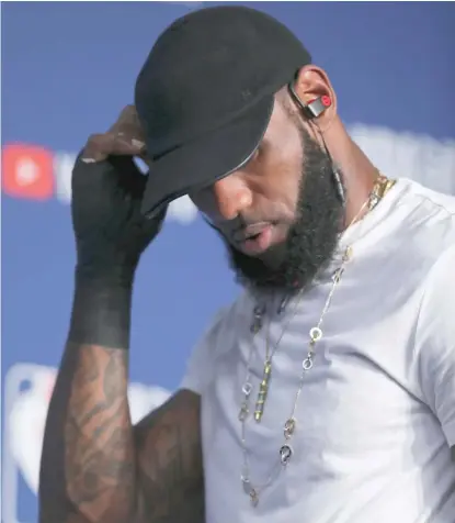  ?? AP ?? LeBron James injured his right hand when he punched a whiteboard after the Cavaliers’ overtime loss in Game 1 of the NBA Finals.