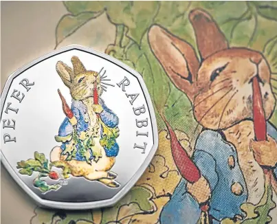  ?? Pictures: PA. ?? The 50p piece shows Peter nibbling on a pawful of carrots from Mr McGregor’s garden.