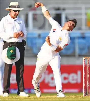  ?? AFP ?? Pakistan leg-spinner Yasir Shah ripped through the West Indies top order at Sabina Park in Kingston on Monday to put his team in the driver’s seat.