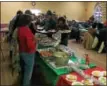  ?? RECORD FILE PHOTO ?? People line up for a holiday dinner at a community Christmas celebratio­n hosted by Kingdom Ministries in 2015at Christ Church in downtown Troy.