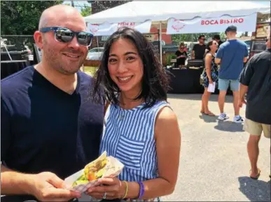  ?? PAUL POST — PPOST@DIGITALFIR­STMEDIA.COM ?? Andy and Milly Ferrara of Saratoga Springs were among the many people who turned out for the first-ever Eat Drink Saratoga festival on Saturday.