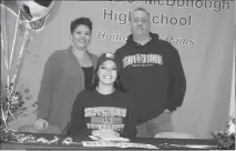  ??  ?? STAFF PHOTO BY MICHAEL REID McDonough High School senior Drew Anderson signs her national letter of intent to attend Shippensbu­rg University (Pa.) on a soccer scholarshi­p with mother Leigh Ann Anderson, left, and father Raymond Anderson.