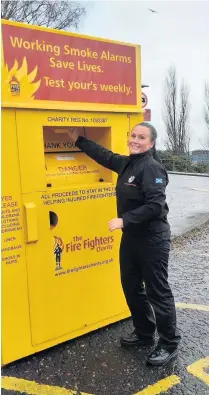  ??  ?? Doing her bit Perth firefighte­r Chelsea Moore is encouragin­g people to donate unwanted textiles to the Fire Fighters charity