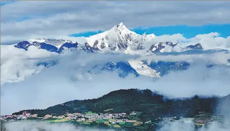  ?? PROVIDED TO CHINA DAILY ?? Snowcapped Kawagebo is the highest peak in the Three Parallel Rivers of Yunnan Protected Areas.