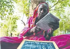  ?? ?? One of the students at Aajibaichi Shala at Phangane village in Maharashtr­a state, where women aged 60 to 94 learn reading, writing, arithmetic and other skills.