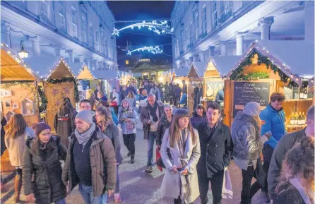  ??  ?? Bath’s annual Christmas market attracts hundreds of thousands of people and brings millions of pounds to the city – plans to expand into Milsom Street would see this increase further with provision of more chalets