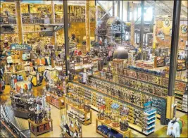  ?? Nati Harnik ?? The Associated Press Several outdoor chains, including this Bass Pro Shops in Council Bluffs, Iowa, continue to sell assault-style rifles online and in stores as part of their mix of hunting equipment.