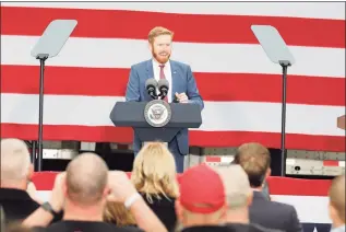  ?? Jeff Kowalsky / TNS ?? Then Republican congressio­nal candidate Peter Meijer introduces U.S. Vice President Mike Pence at a campaign event at Lacks Enterprise­s, Inc. in Grand Rapids, Mich., on Oct. 14. Meijer says he is receiving threats after voting to impeach President Donald Trump.