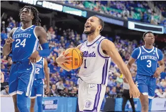  ?? CHRIS CARLSON/ASSOCIATED PRESS ?? Kansas State guard Markquis Nowell celebrates after the Wildcats knocked off Kentucky on Sunday in the second round of the NCAA Tournament in Greensboro, N.C.