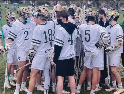  ?? KEV HUNTER — MEDIANEWS GROUP ?? Lansdale Catholic huddles after its win over Archbishop Wood Wednesday.