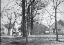  ?? PETE BANNAN — DIGITAL FIRST MEDIA ?? The Triple Fresh store location is on the left and the Fallowfiel­d Friends Meeting is on the right in this 1890s photo.