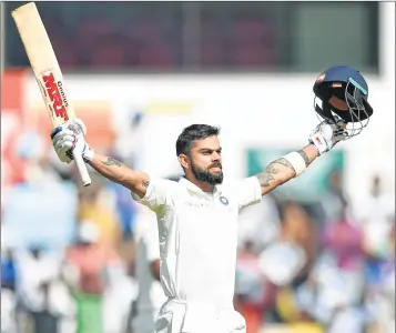  ??  ?? Virat Kohli celebrates after scoring a century at the Vidarbha Cricket Associatio­n Stadium in Nagpur on Sunday