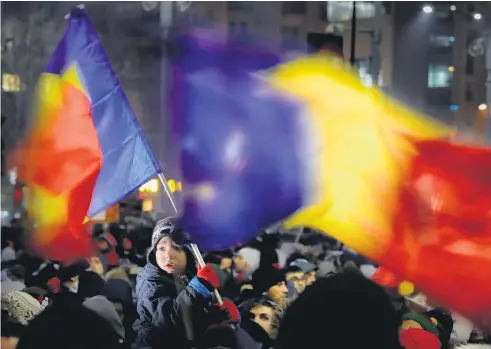 ?? Picture / AP ?? An estimated 80,000 people protested in front of the Government’s headquarte­rs in Bucharest’s biggest square yesterday, while other protests were held around the country.