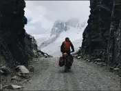  ??  ?? Hollie Ernest is pictured biking in the Andes in Peru.