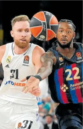  ?? Foto: Efe ?? Dzanan Musa (Real Madrid) y Cory Higgins (Barça).