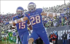  ?? JOE JASZEWSKI / IDAHO STATESMAN ?? Boise State’s Kekaula Kaniho (28) celebrates his 53-yard intercepti­on return for a score in a 38-28 victory over Oregon in the Las Vegas Bowl.