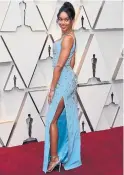  ?? MARK RALSTON GETTY IMAGES ?? BlacKkKlan­sman breakout star Laura Harrier concluded her awards season colour streak in a sustainabl­y made powder-blue gown from Louis Vuitton.