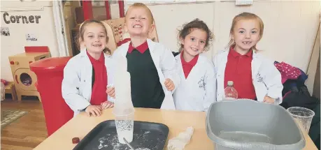  ??  ?? Sunderland youngsters perform a science trick.