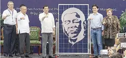  ??  ?? FIRST FILIPINO SOLAR PANEL FACTORY OPENED IN BATANGAS – Solar Philippine­s CEO Leandro Leviste (second from right) presents a ‘Duterte Edition’ solar panel to President Rodrigo Duterte during the inaugurati­on of the country’s first solar panel factory...