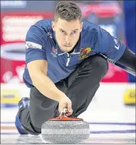  ?? MICHAEL BURNS/CURLING CANADA ?? Team Gushue second Brett Gallant concentrat­es on making a throw during play at the Tim Hortons Roar of the Rings Olympic Curling Trials, being held this week in Ottawa.