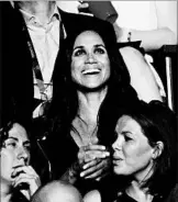  ?? NATHAN DENETTE/THE CANADIAN PRESS ?? Meghan Markle, center, takes in the opening ceremonies of the Invictus Games in Toronto on Saturday.
